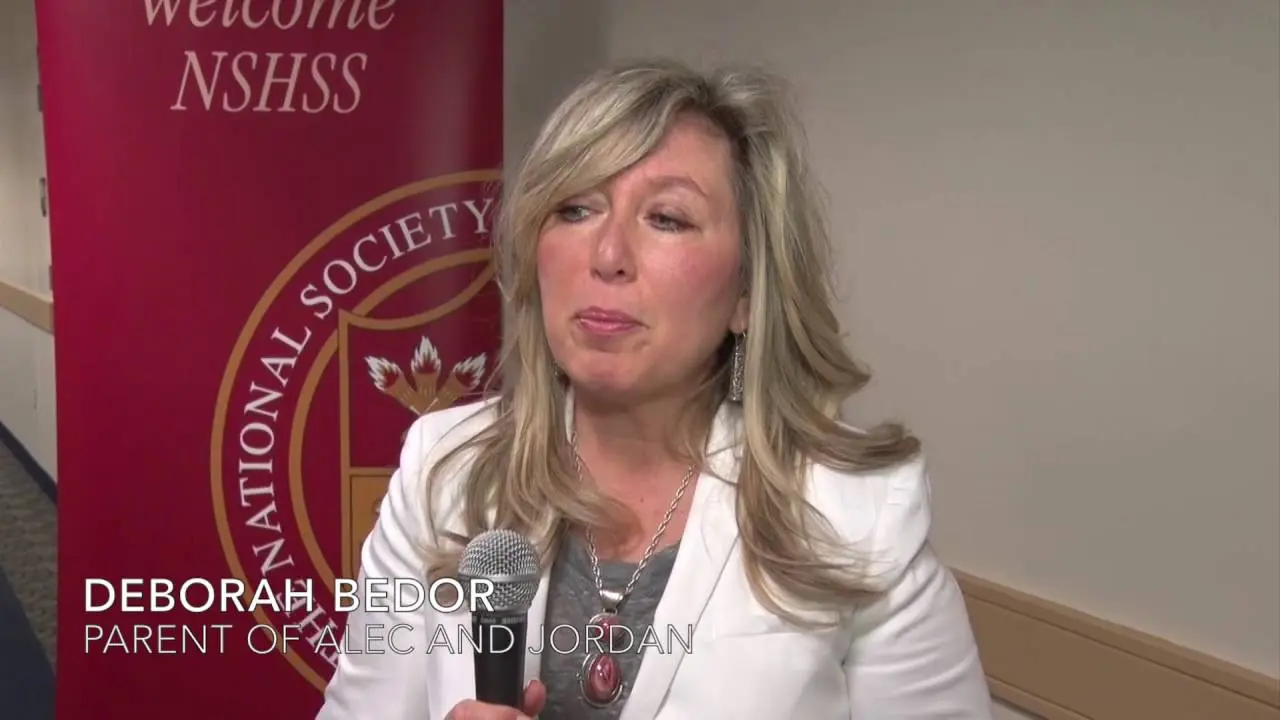 Woman speaking into microphone